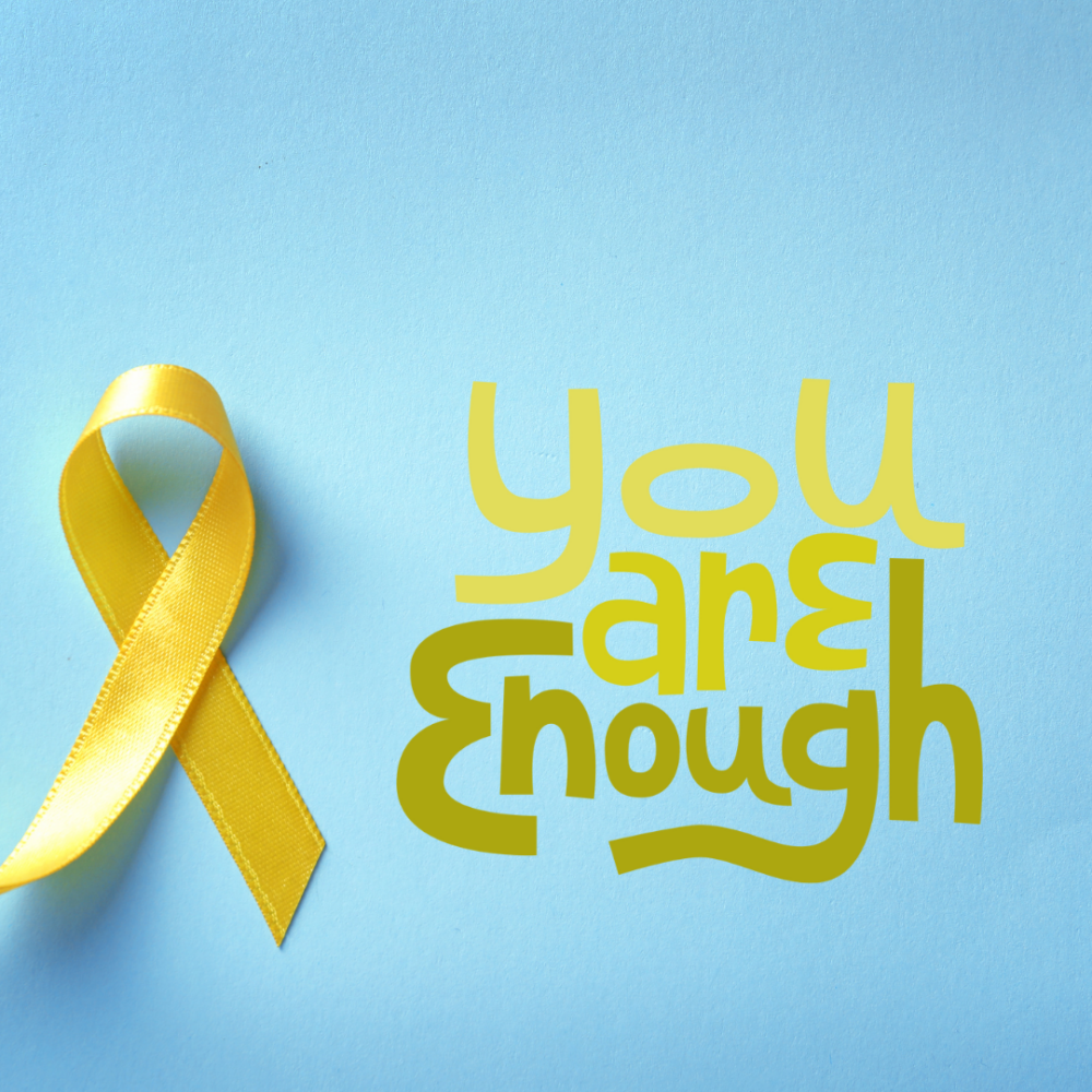 A blue background with a yellow support ribbon and the words "You Are Enough" typed on it.