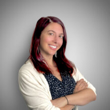 Heather Mastrianno woman with red hair in a white sweater