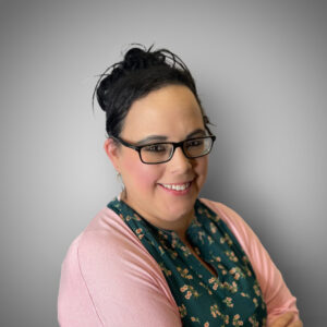 Maria Perez Hispanic woman in a pink sweater